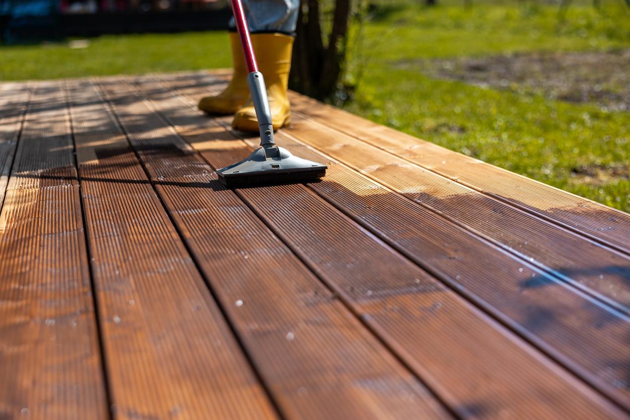 Close-up of stained wood grain on outdoor railing